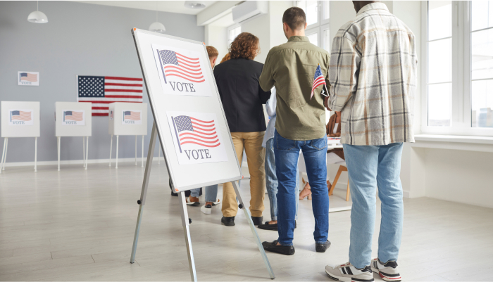 People waiting in line to vote at a polling station.