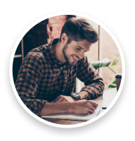 Man writing a thoughtful letter at a desk.