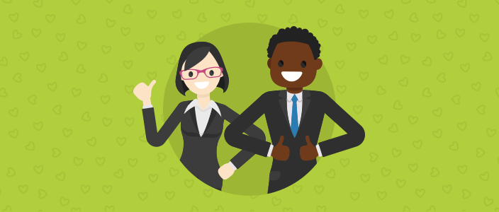 Two office employees giving the thumbs up