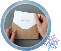 Person pulling a thank you note out of the envelope