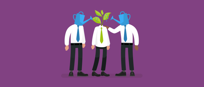 Two office workers advising a third office worker