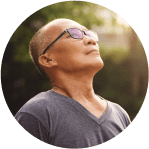 Man meditation outside in the warm sunshine